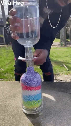 Moving Beads In Glass Bottles GIF by ViralHog