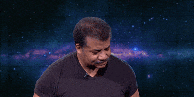 Celebrity gif. Neil Degrasse Tyson stands in front of an outer space background as he raises a hand over his head and looks ahead. Text, "Can I get an Amen!"