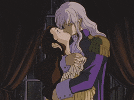 Anime gif. Charlotte and Griffith from Berserk embrace each other. Charlotte turns her head away from Griffith, looking guilty, but he caresses the back of her head and pulls her in close for a kiss. She closes her eyes and gives in.
